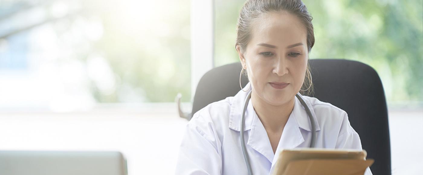 Medical professional using tablet