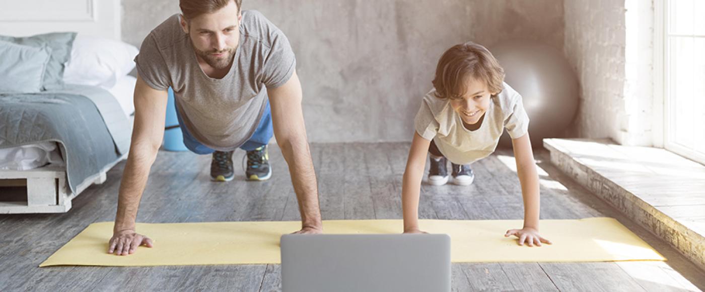 Dad and son exercising at home