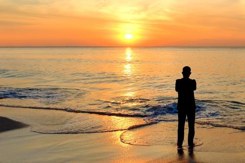 Mental health-silhouette man on beach