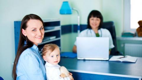 Mother and her daughter with a pediatrician