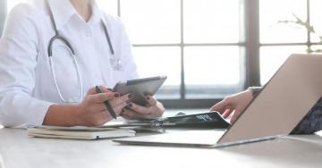 Female doctor on laptop